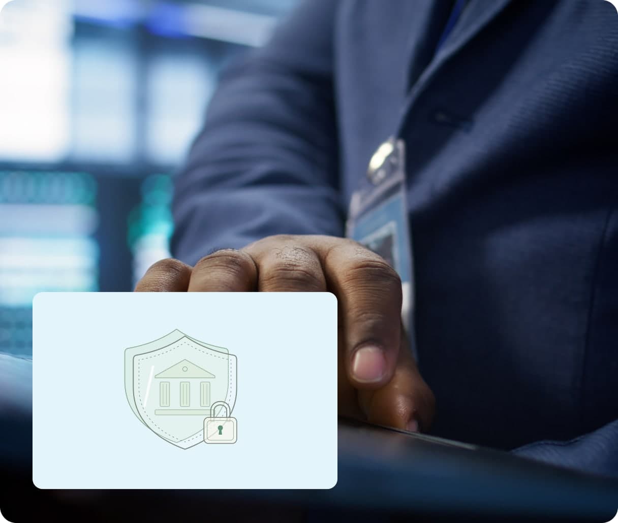 A hand on a laptop beside a shield and bank lock illustration